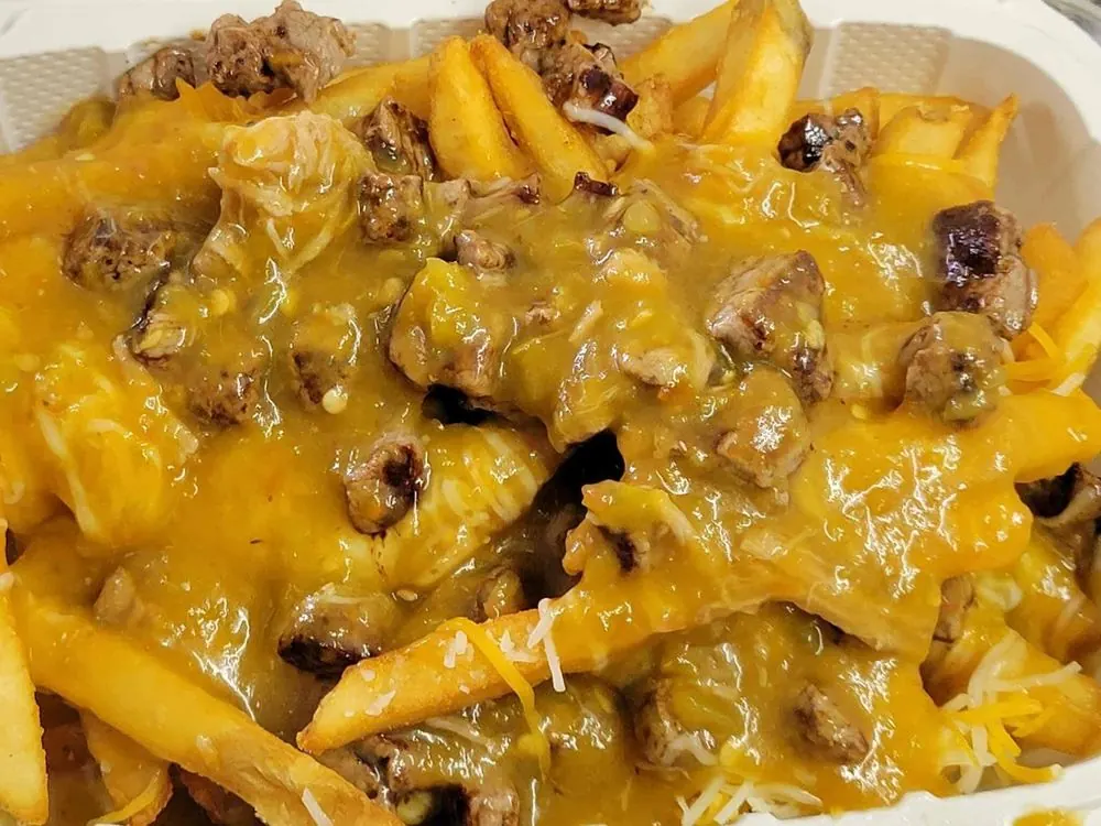 Bryce's Chili Cheese Fries topped with steak and melted cheese